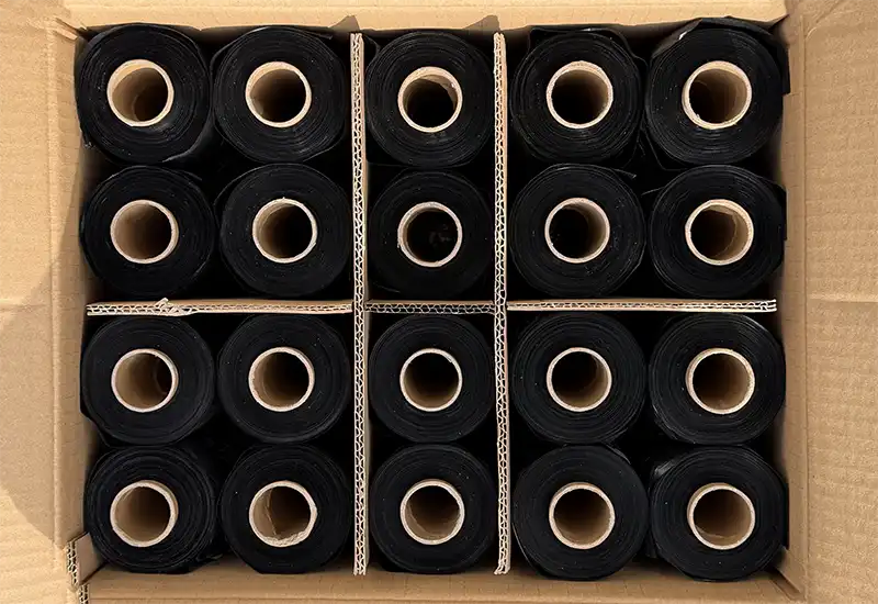 Black HDPE rollers Tipped dog coca bag rolls in a carton.