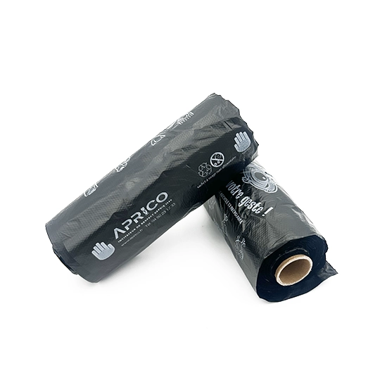 Rolls of black canine bags Two rolls of canine sachets recycle black aprico on a white background.